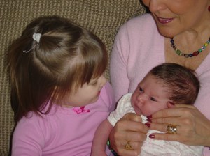 Sydney and Sho Sho holding Brooklyn.